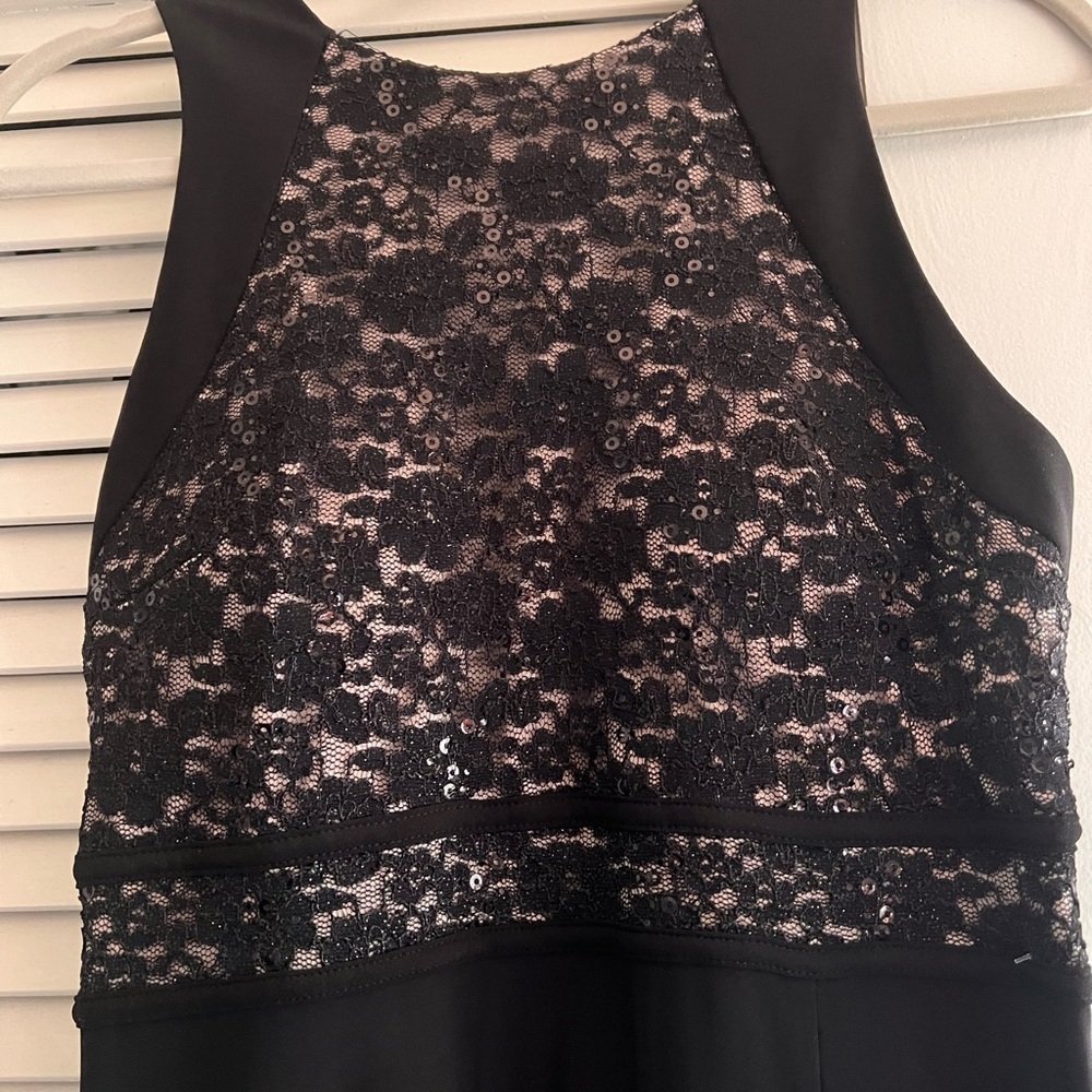 Glamorous black dress with nude lace top and slit skirt